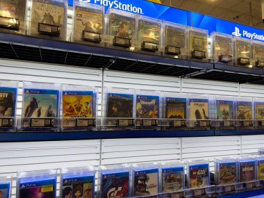Lynnwood, WA USA - circa December 2022: Close up view of Playstation games for sale inside a Best Buy retail store.