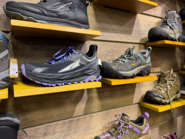 Leavenworth, WA USA - circa December 2022: Close up view of outdoor boots and shoes for sale inside a local sporting goods shop.