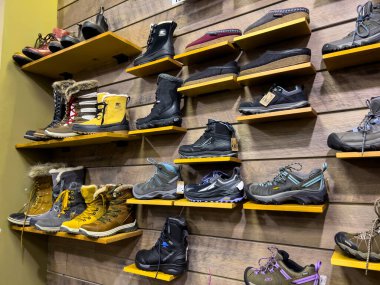 Leavenworth, WA USA - circa December 2022: Close up view of outdoor boots and shoes for sale inside a local sporting goods shop.