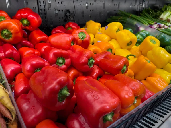 stock image Close up, selective focus on colorful bell peppers for sale inside a grocery store