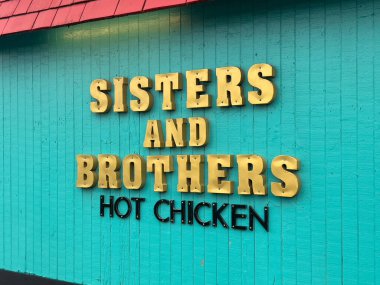 Seattle, WA USA - November 10, 2024: Close up view of Sisters and Brothers Hot Chicken restaurant in the downtown area. clipart