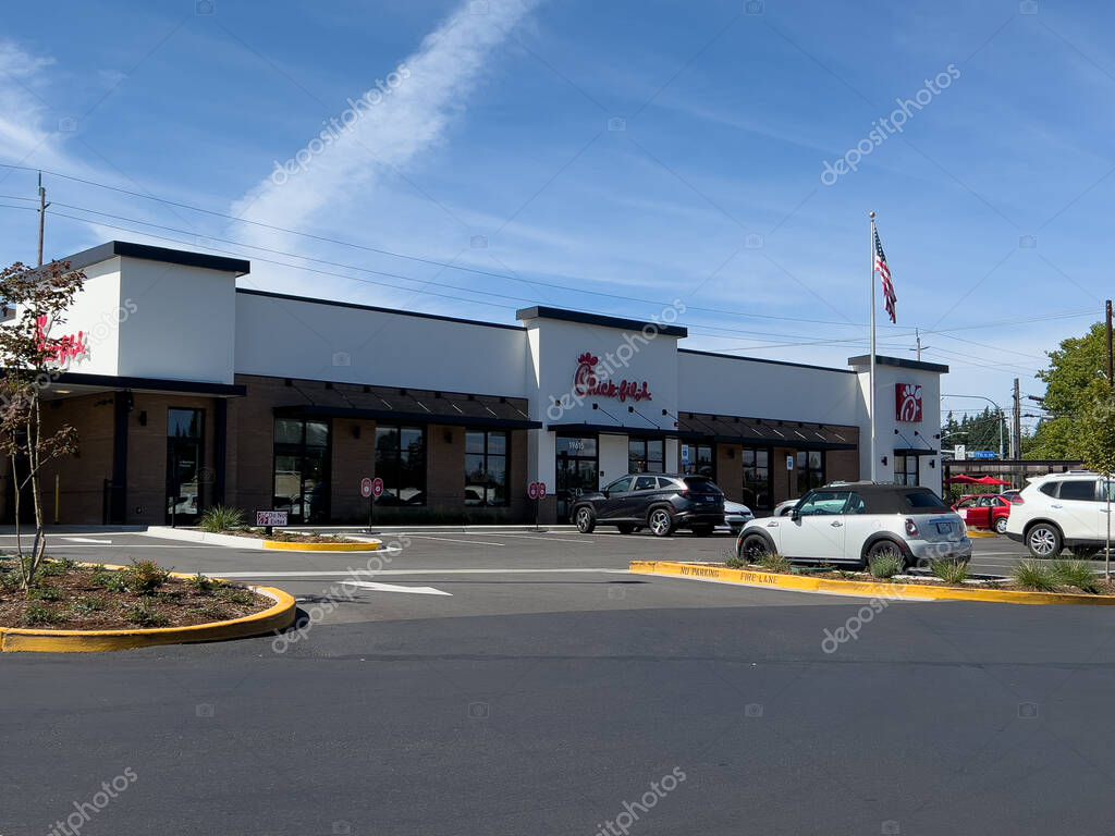 Lynnwood, WA USA - circa June 2, 2024: Wide view of a Chikfila fast food restaurant on a bright sunny day.