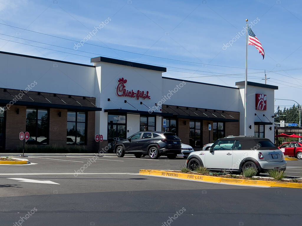 Lynnwood, WA USA - circa June 2, 2024: Wide view of a Chikfila fast food restaurant on a bright sunny day.