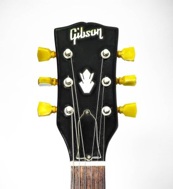 Closeup of guitar tuner or tuning pegs on black headstock.  Classic old school vintage kluson deluxe double ring circa 1966 on Gibson SG solid guitar standard, electric musical instrument clipart