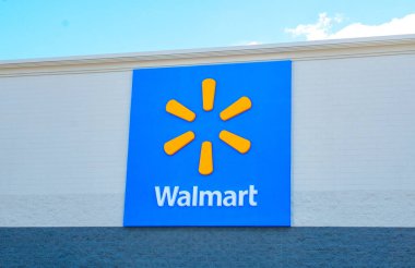 OCALA, FLORIDA ABD - 22 Ekim 2023 Dünya markası Walmart işareti ve logo amblemi. Turuncu çizgi, yıldız, kıvılcım ya da 6 temel değeri temsil eden kıvılcımlar içeren mavi arkaplan