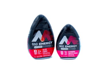 Ocala, FL USA November 2023 Mio energy liquid water enhancer with caffeine and vitamin B. Zero 0 calories Isolated on white background. Black cherry and pineapple strawberry flavors clipart