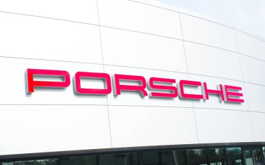 OCALA, FLORIDA USA - January 3, 2024  Porsche dealership with red logo on front of building . Florida clipart