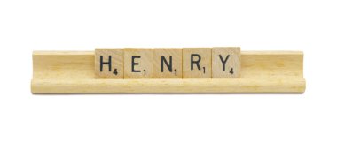 Miami, FL 4-18-24 popular baby boy first name of HENRY made with square wooden tile English alphabet letters with natural color and grain on a wood rack holder isolated on white background clipart