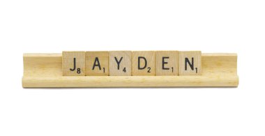 Miami, FL 4-18-24 popular baby boy first name of JAYDEN made with square wooden tile English alphabet letters with natural color and grain on a wood rack holder isolated on white background clipart