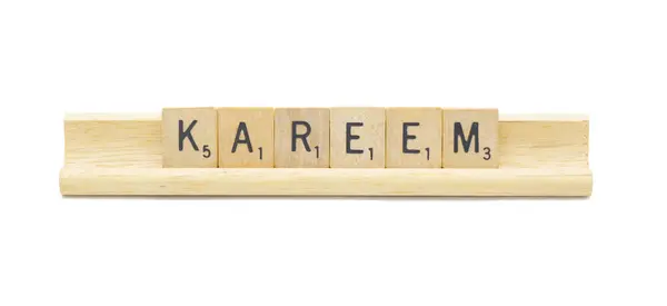 stock image Miami, FL 4-18-24 popular baby boy first name of KAREEM made with square wooden tile English alphabet letters with natural color and grain on a wood rack holder isolated on white background