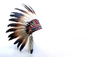 Indian chief headdress native American ethnic feathers of various colors were tied together with cloth and animal skins strung together with colorful beads isolated on white background with copy space clipart