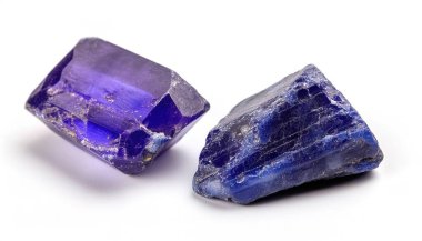 Tanzanite is the blue and violet variety of the mineral zoisite noted for its strong trichroism, appearing alternately blue, violet and burgundy depending on crystal orientation. Isolated on white clipart