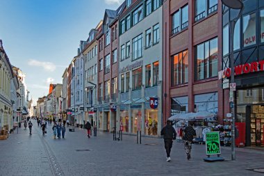 Flensburg, Schleswig-Holstein, Germany - 30 August 2021: Passers-by stroll between stores in the busy Holm shopping street