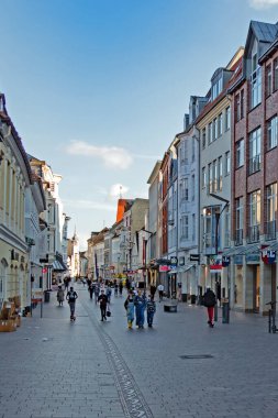 Flensburg, Schleswig-Holstein, Germany - 30 August 2021: Passers-by stroll between stores in the busy Holm shopping street