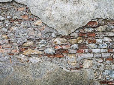 Arkaplan olarak çürümüş taş duvarın yüzeyi