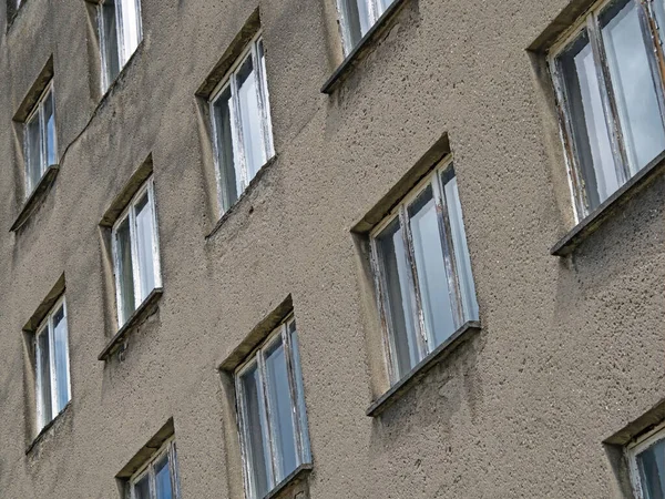 stock image Exterior view of an old apartment block in Prora, diagonal view of the rows of windows, Rugen, Germany