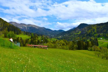 View valley in Karavanke mountains with the peak of Golica and Planina pod Golico in Gorenjska, Slovenia clipart