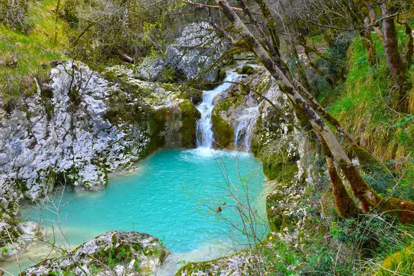 Waterfall at Buzet canyon flowing into a turquoise pool in Istria, Croatia