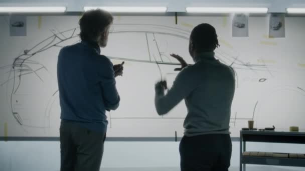 Two Diverse Automotive Male Designers Standing Sketch Whiteboard Discussing Futuristic — Stock Video