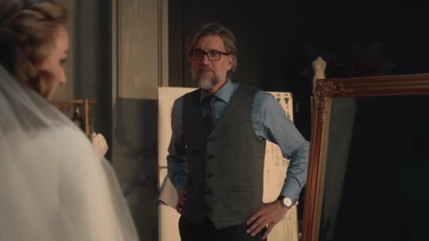 Cinematic Shot Woman Wedding Dress Looking Mirror Talking Male Mature — Stockvideo