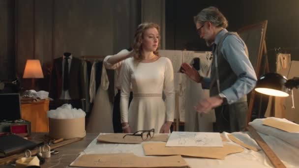Cinematic Shot Tailors Taking Measurements Woman Wedding Dress Bride Fitting — Stock Video