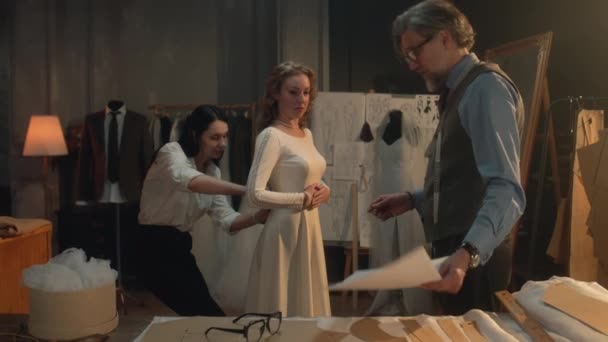 Cinematic Shot Tailors Taking Measurements Woman Wedding Dress Bride Fitting — Stockvideo