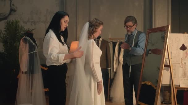 Cinematic Shot Female Tailor Fixing Veil Woman Wedding Dress Front — Wideo stockowe