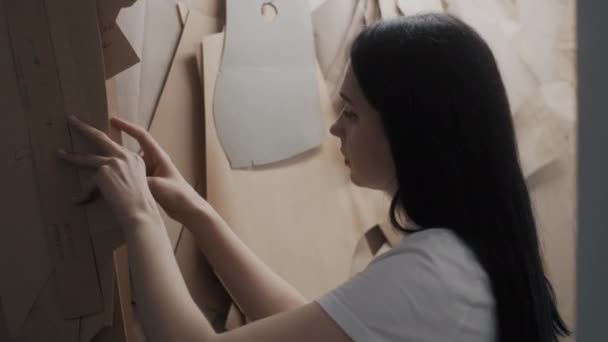 Female Dressmaker Chooses Pattern Tailoring New Clothes Collection Studio Seamstress — Vídeo de Stock