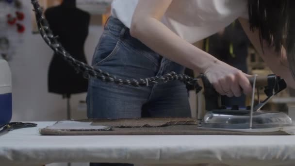 Woman Irons Fabric Textile Atelier Workshop Her Colleagues Working Background — Stockvideo