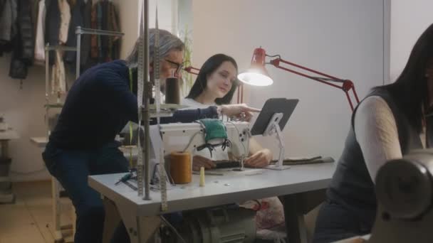 Mature Tailor Seamstress Discussing Sketch Suit Displayed Tablet Female Dressmaker — Video
