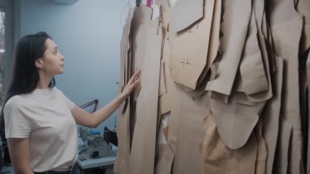 Female Tailor Chooses Pattern Tailoring New Clothes Collection Dressmaker Fashion — Stockvideo