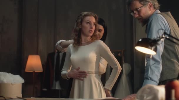 Cinematic Shot Tailors Taking Measurements Woman Wedding Dress Bride Fitting — Vídeo de stock