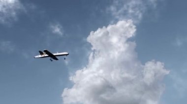 3D animation of military drone flight. Combat drone on military mission. Cloudy sky on background. Remotely-piloted aircraft. Concept of using modern UAV technology for military battles or in war.