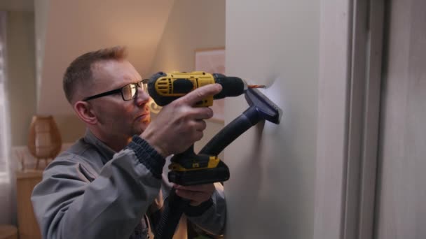 Caucasian Man Uniform Glasses Drills Hole Concrete Wall Drilling Machine — ストック動画