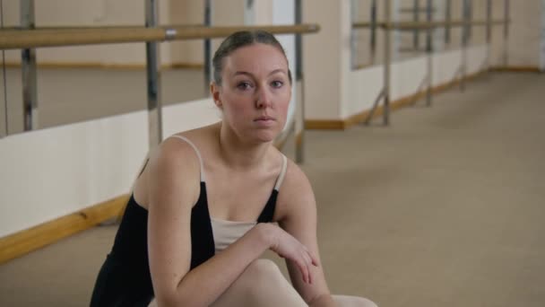 Exhausted Ballerina Training Bodysuit Sits Floor Stretching Workout Dance Studio — Video Stock