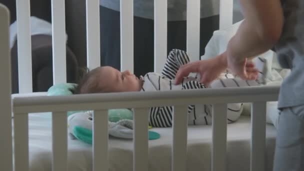 Close Shot Sweet Beautiful Baby Bodysuit Lying Sheets Cradle Nursery — Stock Video
