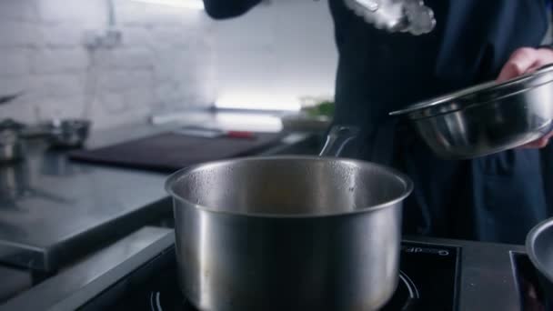 Professional Chef Cook Apron Puts Ravioli Kitchen Tongs Saucepan Boiling — Stock Video