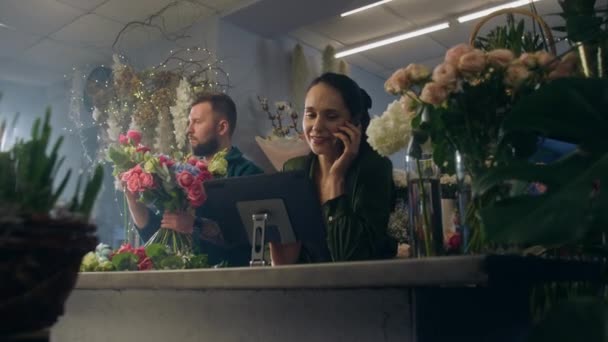 Female Entrepreneur Florist Talks Phone Customer Takes Online Order Flower — Stock Video
