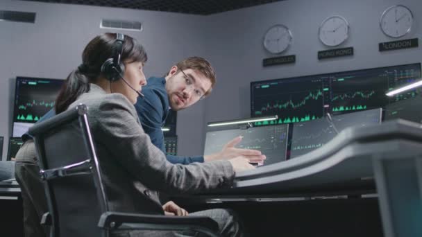 Financial Analysts Monitor Discuss Real Time Stocks Data Computer Businesspeople — Stock Video