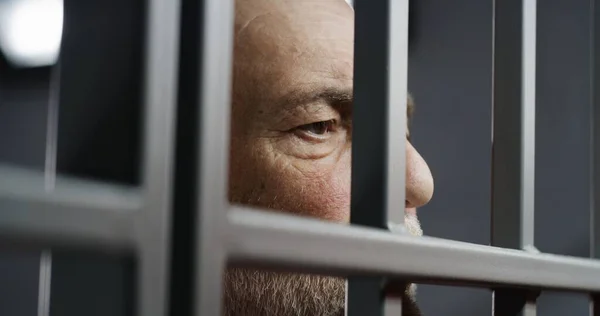 Face Close Depressed Elderly Prisoner Standing Metal Bars Prison Cell — Stock Photo, Image