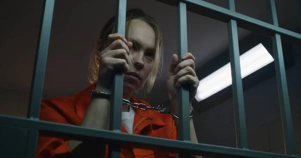 Female Prisoner Orange Uniform Stands Prison Cell Scared Woman Criminal — Stock Photo, Image