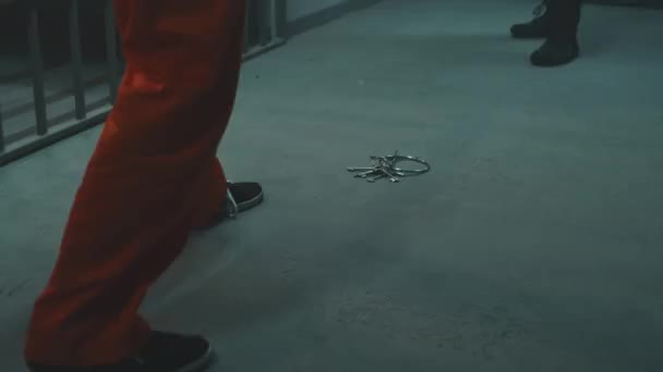 Prisoner Orange Uniform Pushes Keys His Foot Cellmate Fight Another — Stockvideo