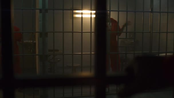 One Angry Female Prisoner Orange Uniform Yells Neighbor Inmate Jumps — Stock Video