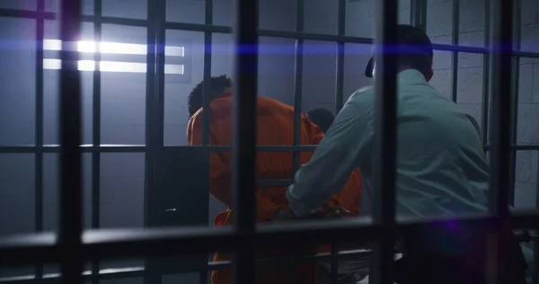 Prison Employee Puts Handcuffs Guilty Inmate Orange Uniform Leads Him — Stock Photo, Image