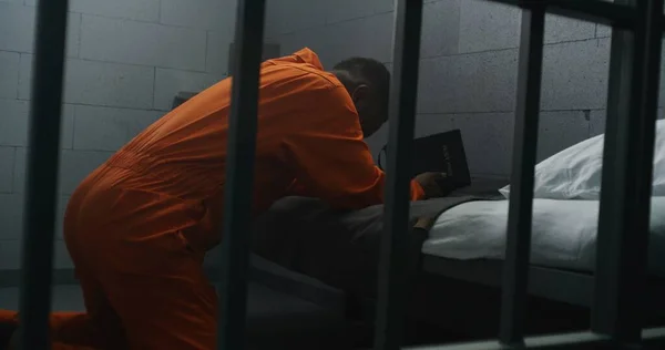 Religious African American Prisoner Orange Uniform Kneels Bed Prays God — Stock Photo, Image