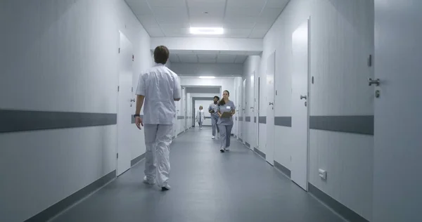 Multiracial Medical Staff Uniform Walk Clinic Corridor Elderly Patient Goes — Stock Photo, Image