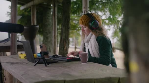 Female Musician Headphones Plays Digital Electric Piano Creates Music Moves — Stock Video