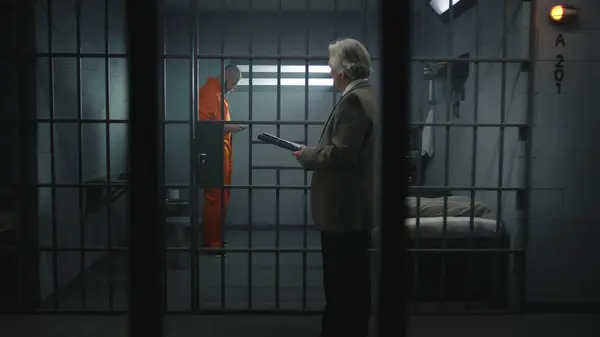 Prisoner Orange Uniform Walks Bars Prison Cell Talks Advocate Reads — Stock Photo, Image