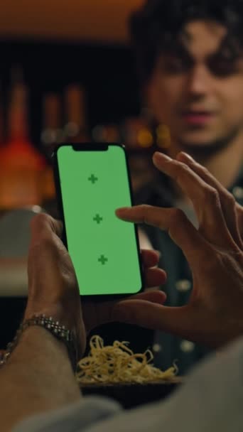 Vertical Shot Mature Man Uses Mobile Phone Green Screen Checks — Stock video