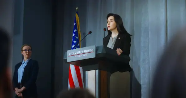 stock image US presidential candidate comes to tribune and starts performance, answers journalists questions and gives interview to media. Female American republican politician at press conference. Elections day.